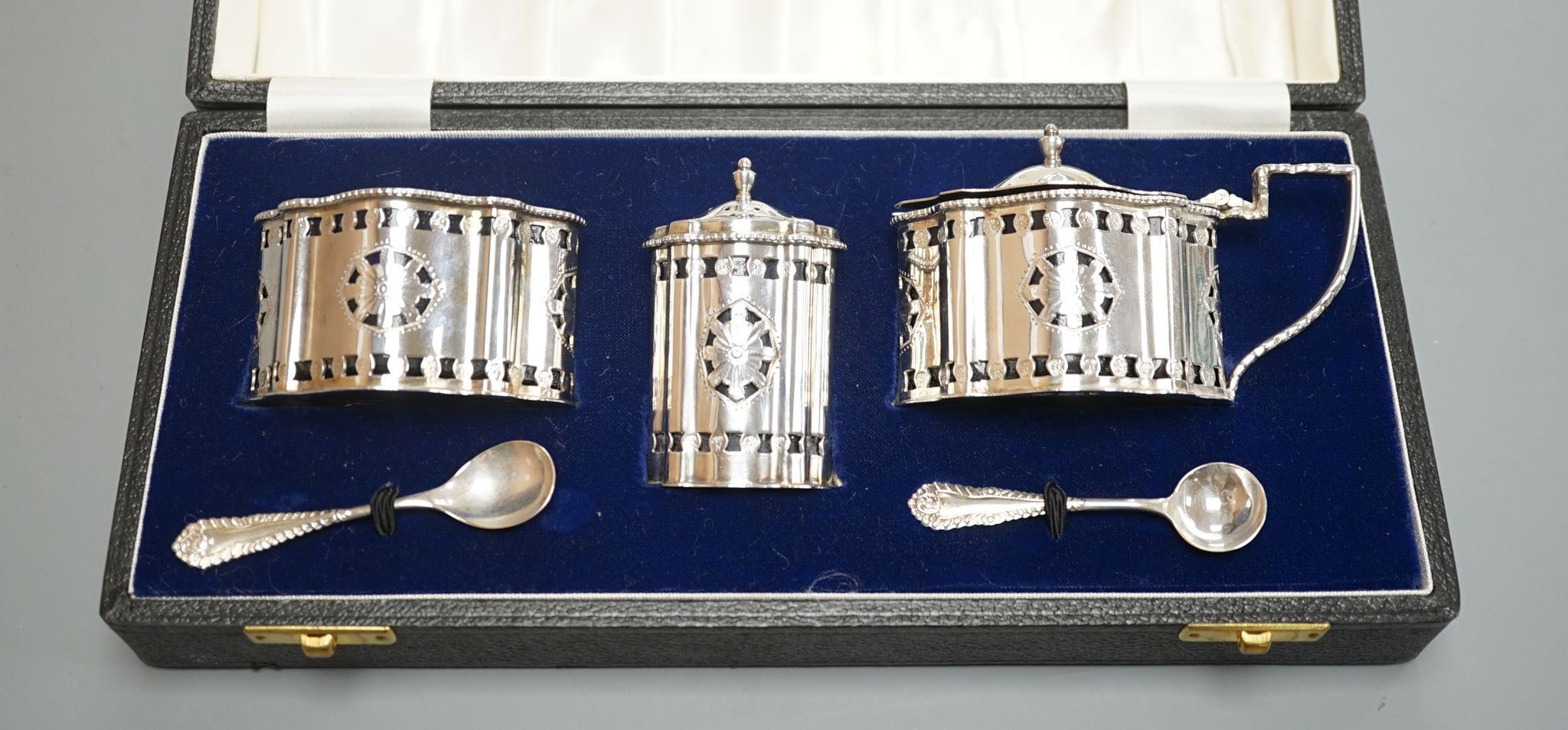 A modern cased three piece silver condiment set, by A. Chick & Sons Ltd, London, 1971.